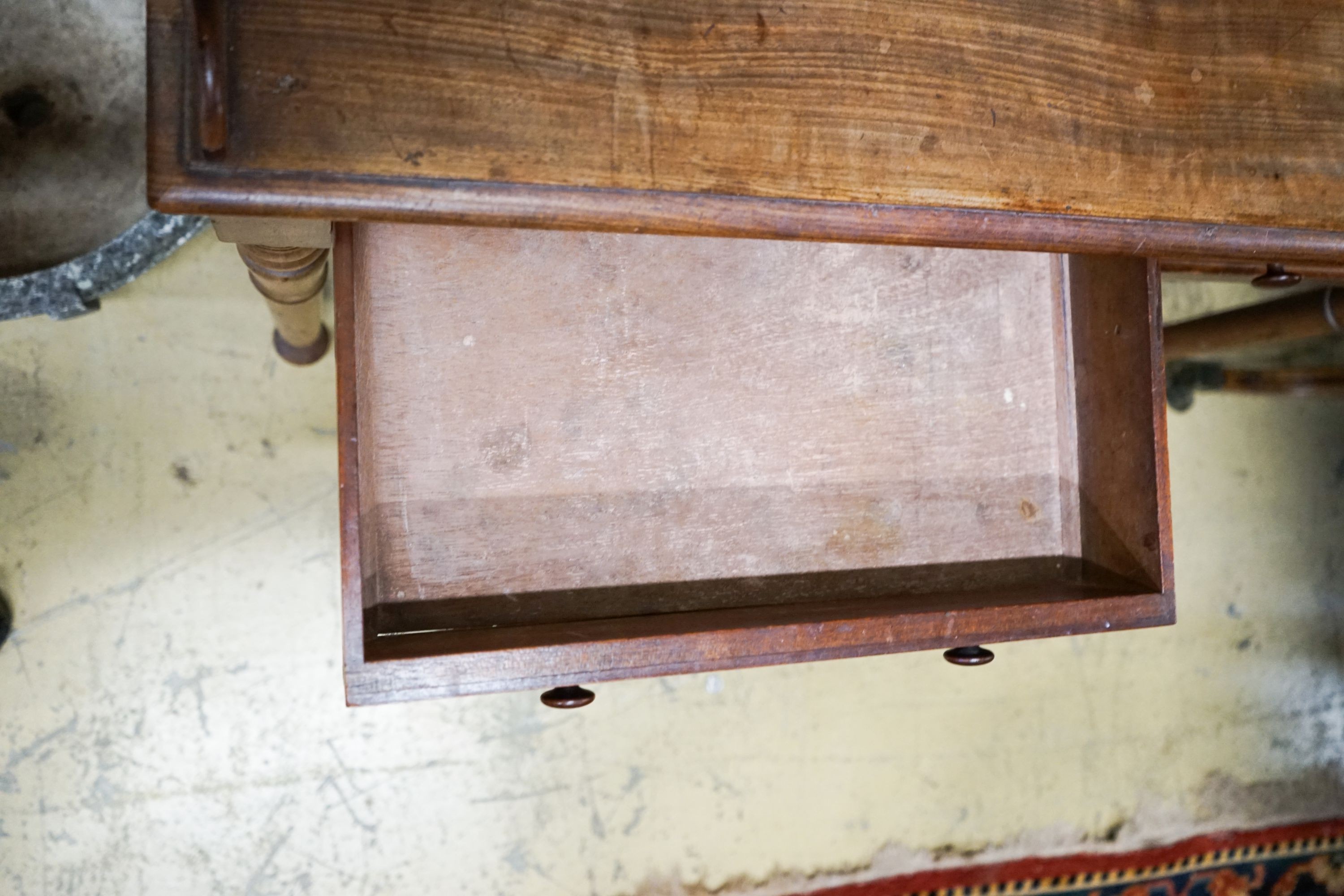 A Victorian mahogany two drawer side table stamped 